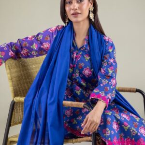 A model wearing a 1-26-122-A-E and 1-26-122-B-E 2-piece lawn suit by Khaadi. The outfit features a long kurta with intricate vertical patterns and detailed borders, paired with dyed trousers and a matching printed dupatta with striped and floral designs. The model stands against a plain background, holding the dupatta, with product fabric details displayed on the left side.