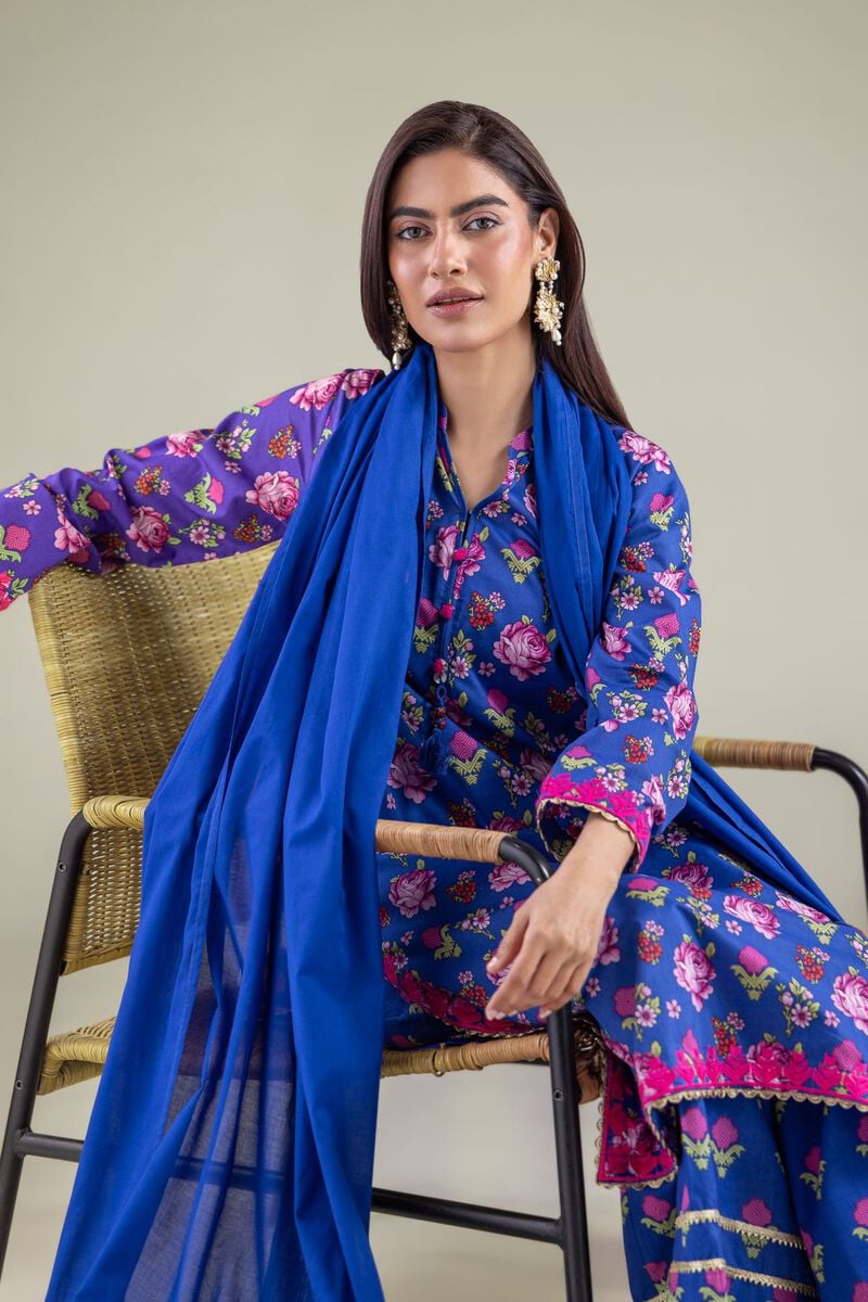 A model wearing a 1-26-122-A-E and 1-26-122-B-E 2-piece lawn suit by Khaadi. The outfit features a long kurta with intricate vertical patterns and detailed borders, paired with dyed trousers and a matching printed dupatta with striped and floral designs. The model stands against a plain background, holding the dupatta, with product fabric details displayed on the left side.