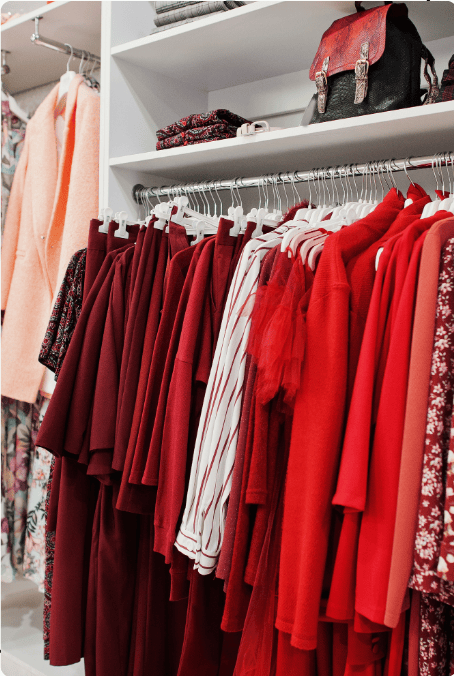 Red fashion dresses collection on rack at Khushnumaa