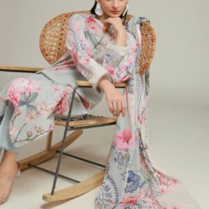 A model wearing a A22-26-103FF1 3-piece lawn suit by Khaadi. The outfit features a long kurta with intricate vertical patterns and detailed borders, paired with dyed trousers and a matching printed dupatta with striped and floral designs. The model stands against a plain background, holding the dupatta, with product fabric details displayed on the left side.