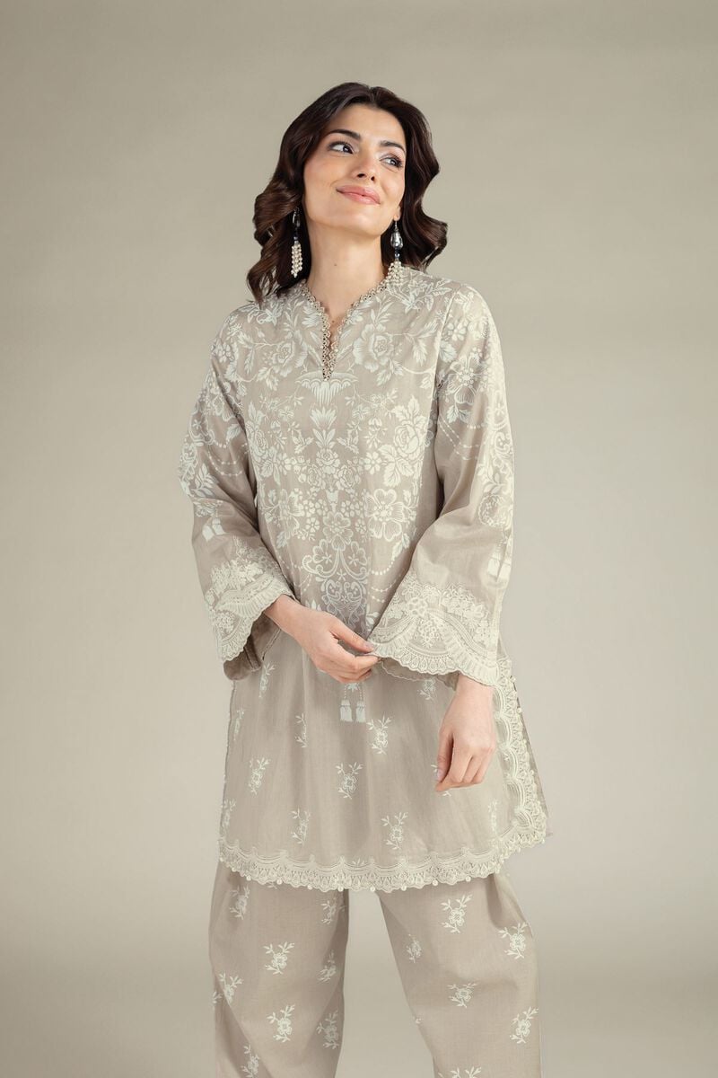 Beige embroidered Pakistani lawn suit for women featuring an elegant floral embroidered kurti with matching straight trousers, perfect for summer wear.