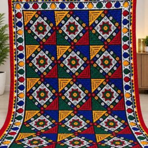Traditional Sindhi embroidered Ralli textile with colorful geometric diamond motifs